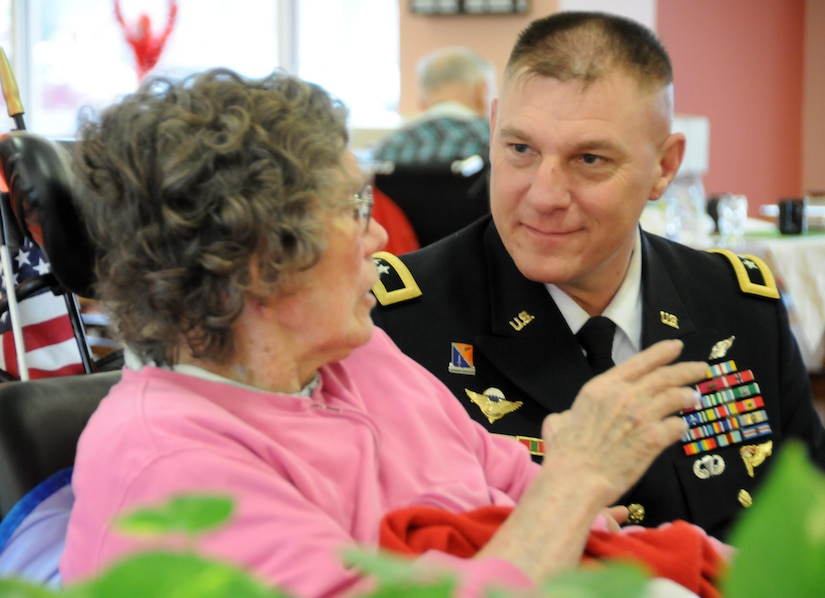 Maj. Gen. Troy D. Kok, commanding general of the U.S. Army Reserve’s 99th Regional Support Command headquartered at Joint Base McGuire-Dix-Lakehurst, New Jersey, meets with Jane M. Underkofler, an Air Force first lieutenant who served as a registered nurse, during a Jan. 28 visit to the New Jersey Department of Military and Veterans Affairs’ Veterans Memorial Home in Vineland, New Jersey. The purpose of Kok’s visit was to thank veterans for their service and encourage young Soldiers to spend time with veterans in their local area.