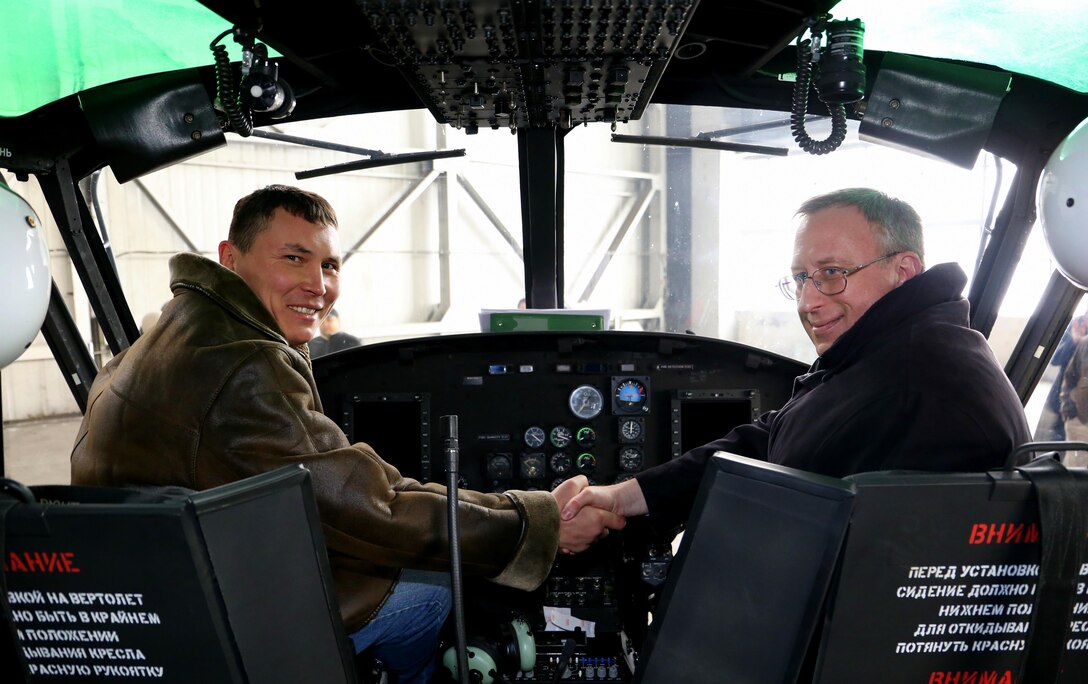 ALMATY, Kazakhstan (Jan. 27,2017) U.S.Ambassador to Kazakhstan, George Krol, right, shakes hands with Kazakh Air Force Major Sergey Kokonov insde of a Huey II Helicopter that was handed over to the Ministry of Defense of Kazakhstan. This is the fourth Huey helicopter provided to Kazakhstan through the U.S. Foreign Military Sales Program. (Courtesy photo)