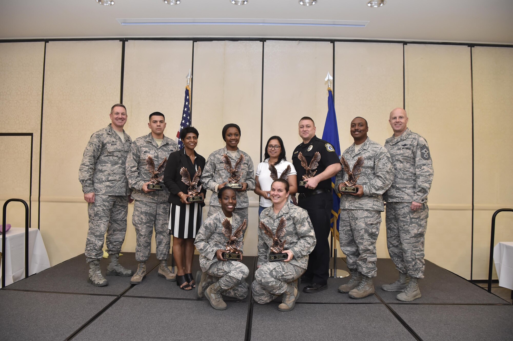 Members from the 628th Air Base Wing were recognized by Col. Robert Lyman, 628th ABW commander, left, and Chief Master Sgt. Todd Cole, 628th ABW command chief, at the 2016 4th Quarter Awards ceremony Jan. 18 at the Charleston Club. These Airmen were recognized for their outstanding accomplishments during the last quarter.