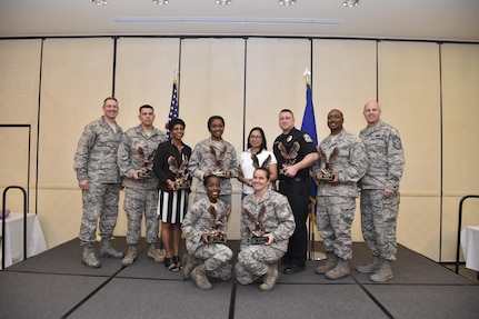Members from the 628th Air Base Wing were recognized by Col. Robert Lyman, 628th ABW commander, left, and Chief Master Sgt. Todd Cole, 628th ABW command chief, at the 2016 4th Quarter Awards ceremony Jan. 18 at the Charleston Club. These Airmen were recognized for their outstanding accomplishments during the last quarter.