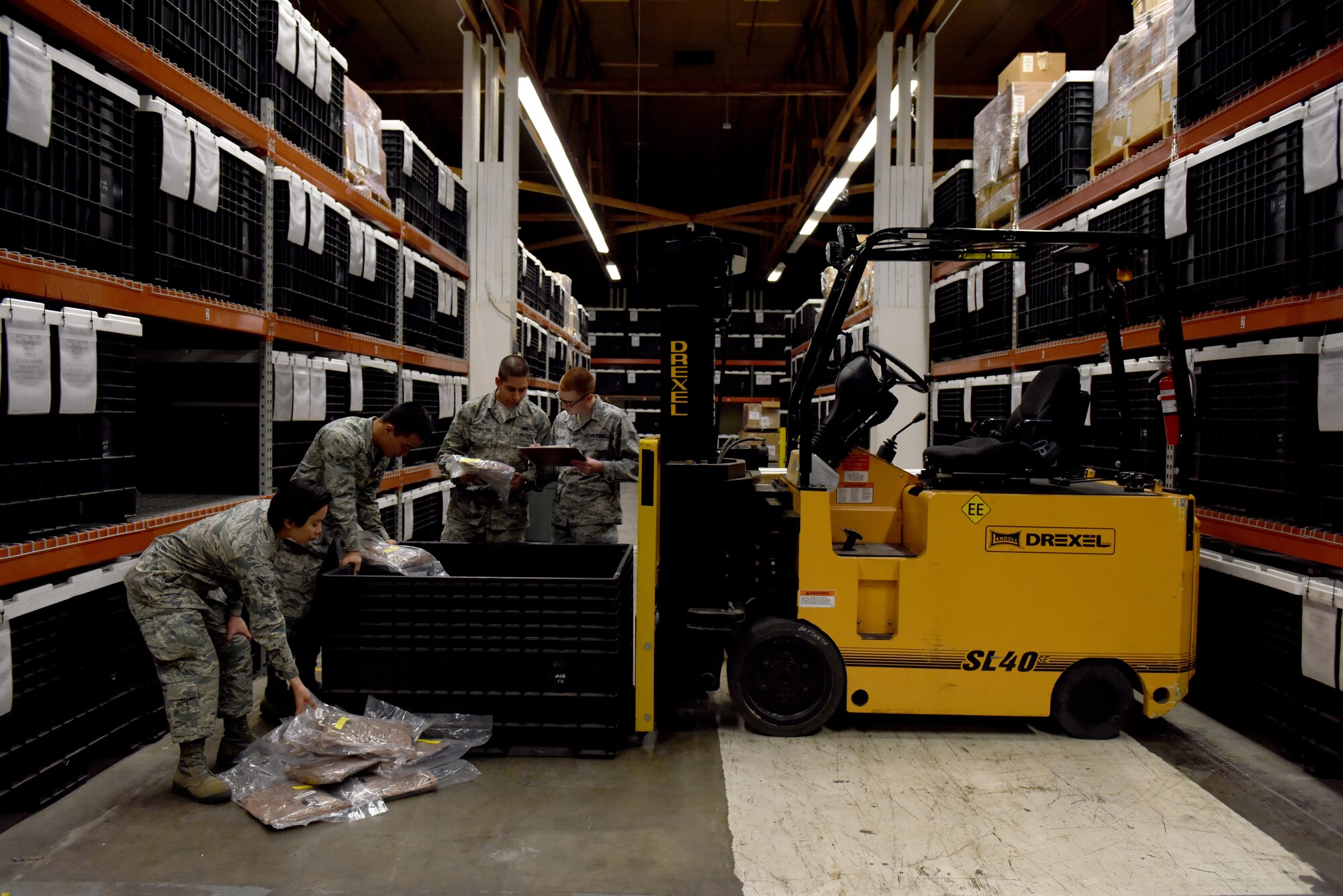 Members of the individual protective equipment (IPE) shop assigned to the 509th Logistics Readiness Squadron (LRS) perform an inventory check in support of the 442d LRS at Whiteman Air Force Base, Mo., Jan. 18, 2017. The Airmen ensured the content in the storage containers were correctly sealed and did not pass their expiration date. (U.S. Air Force photo by Senior Airman Danielle Quilla)