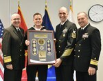 FALLS CHURCH, Va. (Jan. 27, 2017) 

Vice Adm. Forrest Faison, Navy surgeon general and chief, Bureau of Medicine and Surgery, joins deputy surgeon general of the Navy Rear Adm. Terry J. Moulton and Force Master Chief Terry J. Prince, Hospital Corps director, in congratulating Hospital Corpsman 1st Class Cameron Graham, of Navy Medicine Training Support Center as Navy Medicine's 2016 Sailor of the Year. 

(U.S. Navy photo by Mariah Felipe/Released)