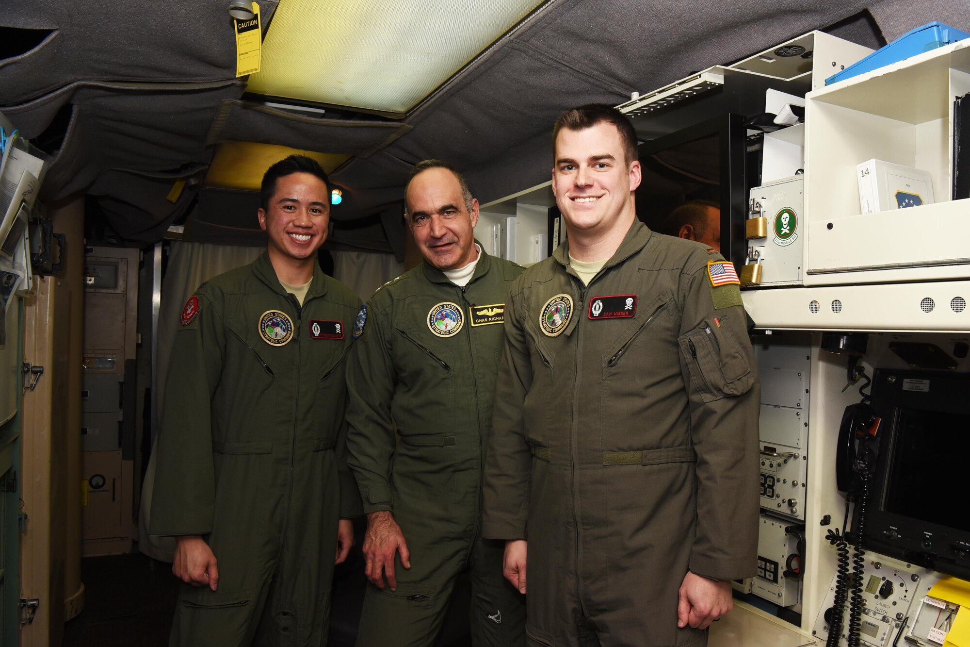U.S. Navy Vice Adm. Charles “Chas” A. Richard, U.S. Strategic Command deputy commander, visits with 1st Lt. Terrence Duarte, 320th Missile Squadron missile combat crew commander, and 2nd Lt. Samuel Wieser, 320th MS deputy missile combat crew commander, inside a launch control center in the 90th Missile Wing missile complex, Jan. 26, 2017. (U.S. Air Force photo by Airman 1st Class Breanna Carter)