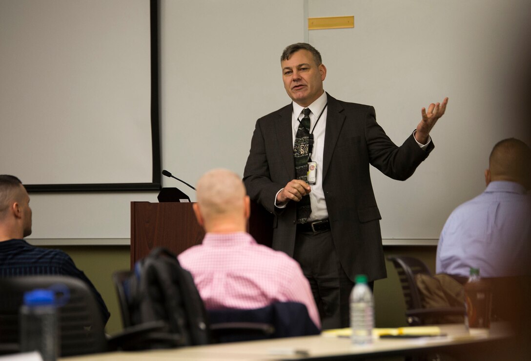 Gregg T. Habel, executive director, Marine Forces Reserve and Marine Forces North speaks to Marines and Sailors about the importance discussing equal opportunity issues during the Senior Leadership Workshop aboard Marine Corps Support Facility New Orleans, Jan. 23-26, 2017. The workshop aims to emphasize the importance of open communication and equal opportunity, and to demonstrate their effects on unit cohesion, mission accomplishment and mission readiness. (U.S. Marine Corps photo by Sgt. Sara Graham) 