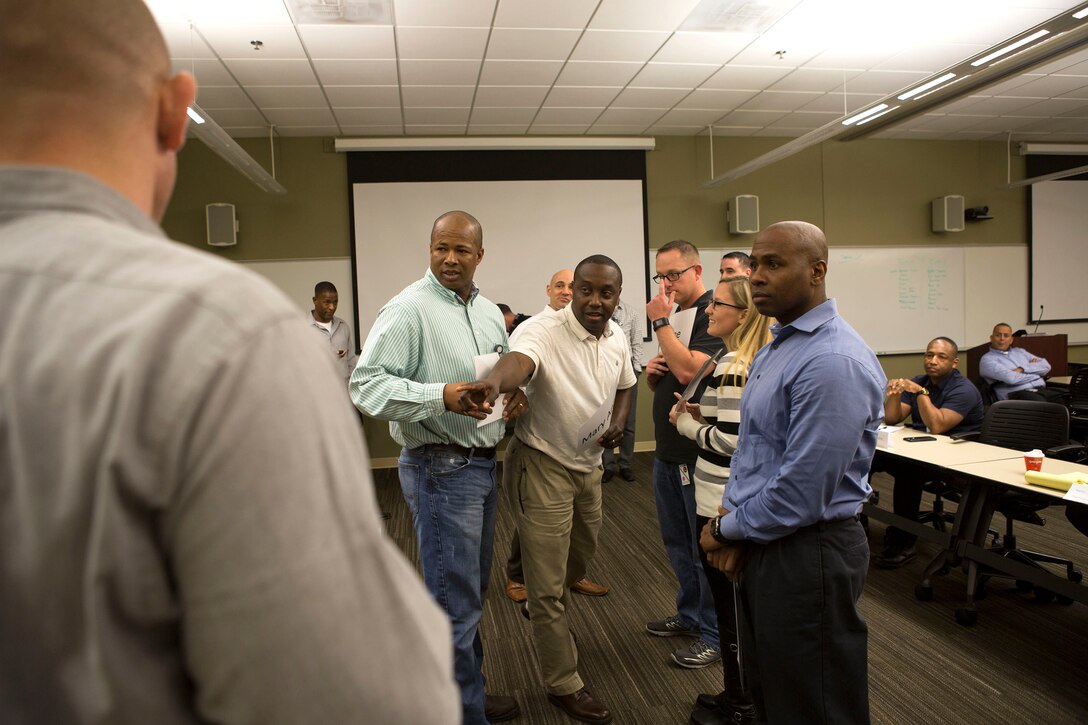 Senior leaders are tasked to make life or death decisions based on the face-value of a person during an exercise at the Senior Leadership Workshop aboard Marine Corps Support Facility New Orleans, Jan. 23-26, 2017. The exercise required the Marines and Sailors to make the decision on who would be saved from a sinking ship and who would be sacrificed based on a small paragraph on information given about a person. The workshop utilizes various exercises and discussions to help leaders address equal opportunity matters while putting their own personal biases and judgments aside. (U.S. Marine Corps photo by Sgt. Sara Graham) 