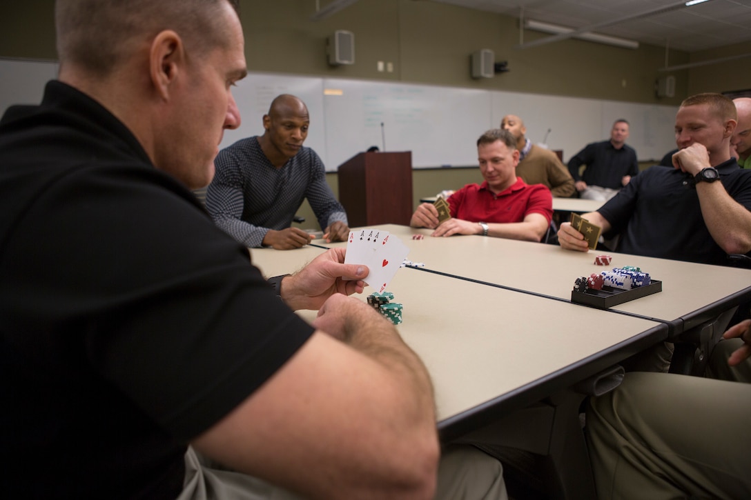 Senior leaders from across Marine Forces Reserve participate in “Poker Power” during the Senior Leadership Workshop at Marine Corps Support Facility New Orleans, Jan. 23-26, 2017. The exercise stacks the deck to give a certain demographic of students an unfair advantage, serving as an example for privilege based on things like race or gender. The workshop aims to open communication about the importance of equal opportunity issues such as discrimination, power, gender, ethnicity, sexism, diversity, leadership influence and more. Throughout the course the leaders discussed how these issues can affect unit cohesion, mission accomplishment and mission readiness. (U.S. Marine Corps photo by Sgt. Sara Graham)