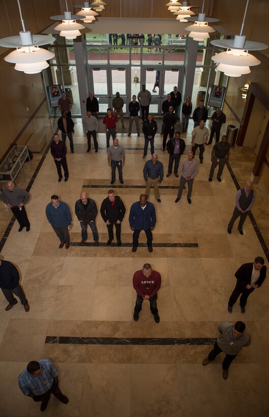 Senior leaders from across Marine Forces Reserve participate in “Power Shuffle” during the Senior Leadership Workshop at Marine Corps Support Facility New Orleans, Jan. 23-26, 2017. The exercise shows how societies segregate different categories of people along the lines of power. The Marines and Sailors took steps forward or back after starting on the same line to demonstrate how differences in gender, racial heritage, sexual orientation, religion, age, and more can allow some groups to be given more power than others. Throughout the course the leaders discussed how these issues can affect unit cohesion, mission accomplishment and mission readiness.  (U.S. Marine Corps photo by Sgt. Sara Graham)  