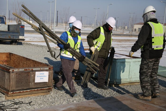 Members of the 22nd Korea Service Corps Mobile Labor Force unpack tent components in Camp Humphreys, Jan. 25, 2017. The tents will make up the temporary life support area in preparation of Key Resolve '17. 