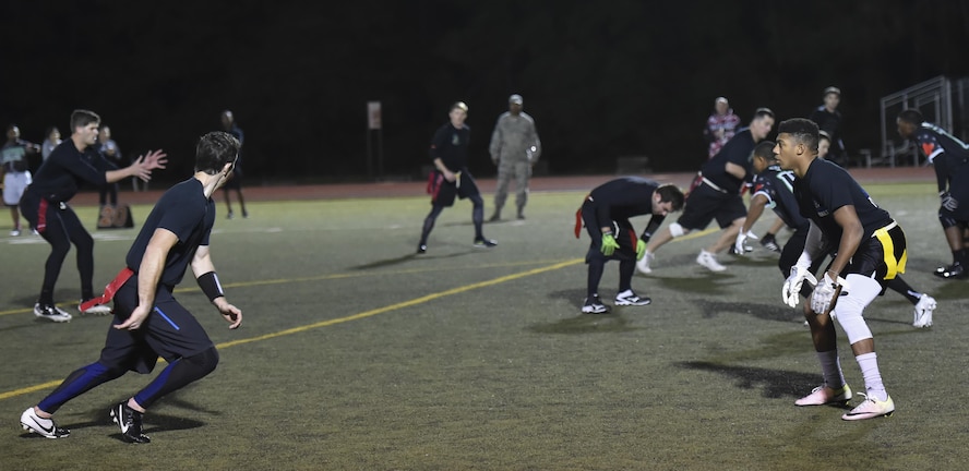A defensive player for the 1st Special Operations Medical Group intramural flag football team, guards a receiver for 23rd Special Tactics Training Squadron team during the flag football championship at Hurlburt Field, Fla., Jan. 26, 2017. The 1st SOMDG defeated the 23rd STTS by the score of seven to six. (U.S. Air Force photo by Airman 1st Class Joseph Pick)