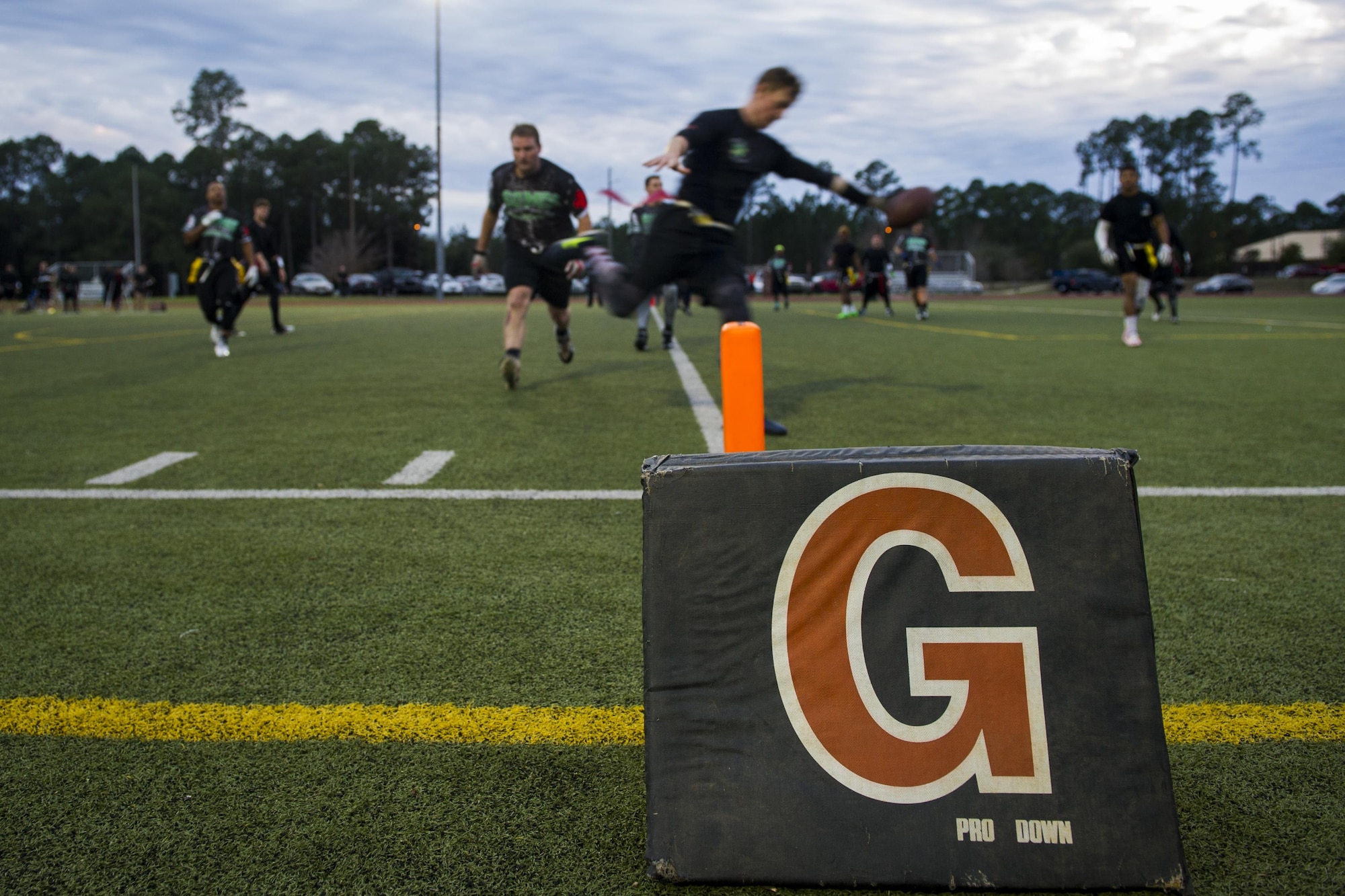 A receiver for the 23rd Special Tactics Training Squadron intramural flag football team crosses the goal line during the flag football championship at Hurlburt Field, Fla., Jan. 26, 2017. The 1st Special Operations Medical Group defeated the 23rd STTS by the score of seven to six. (U.S. Air Force photo by Airman 1st Class Joseph Pick)