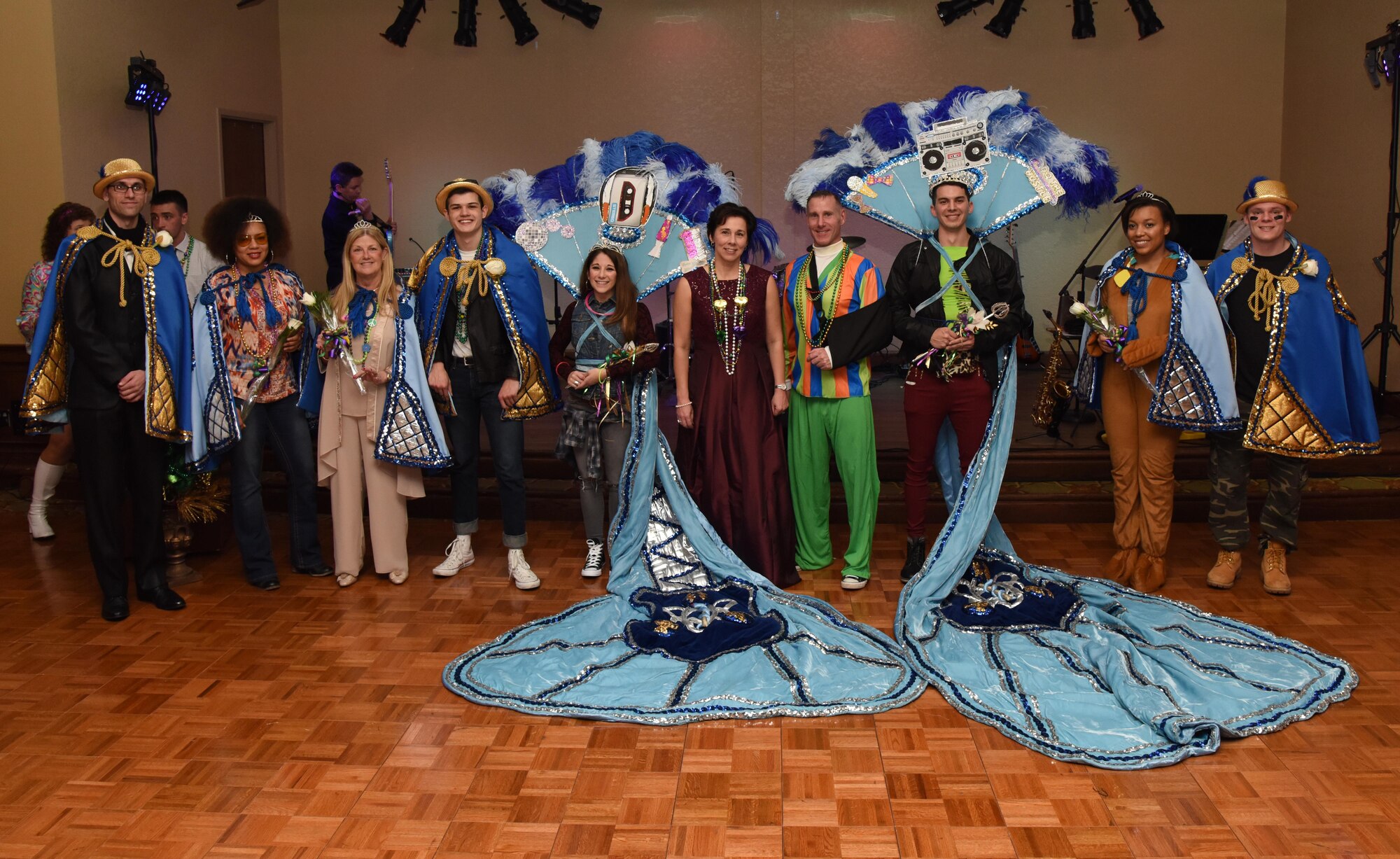 The 2017 Krewe of Medics King and Queen and their court pose for a photo during the 29th Annual Krewe of Medics Mardi Gras Ball at the Bay Breeze Event Center Jan. 28, 2017, on Keesler Air Force Base, Miss. The Krewe of Medics hosts a yearly ball to give Keesler Medical Center personnel a taste of the Gulf Coast and an opportunity to experience a traditional Mardi Gras. The theme for this year's ball was Blast From The Past. (U.S. Air Force photo by Kemberly Groue)