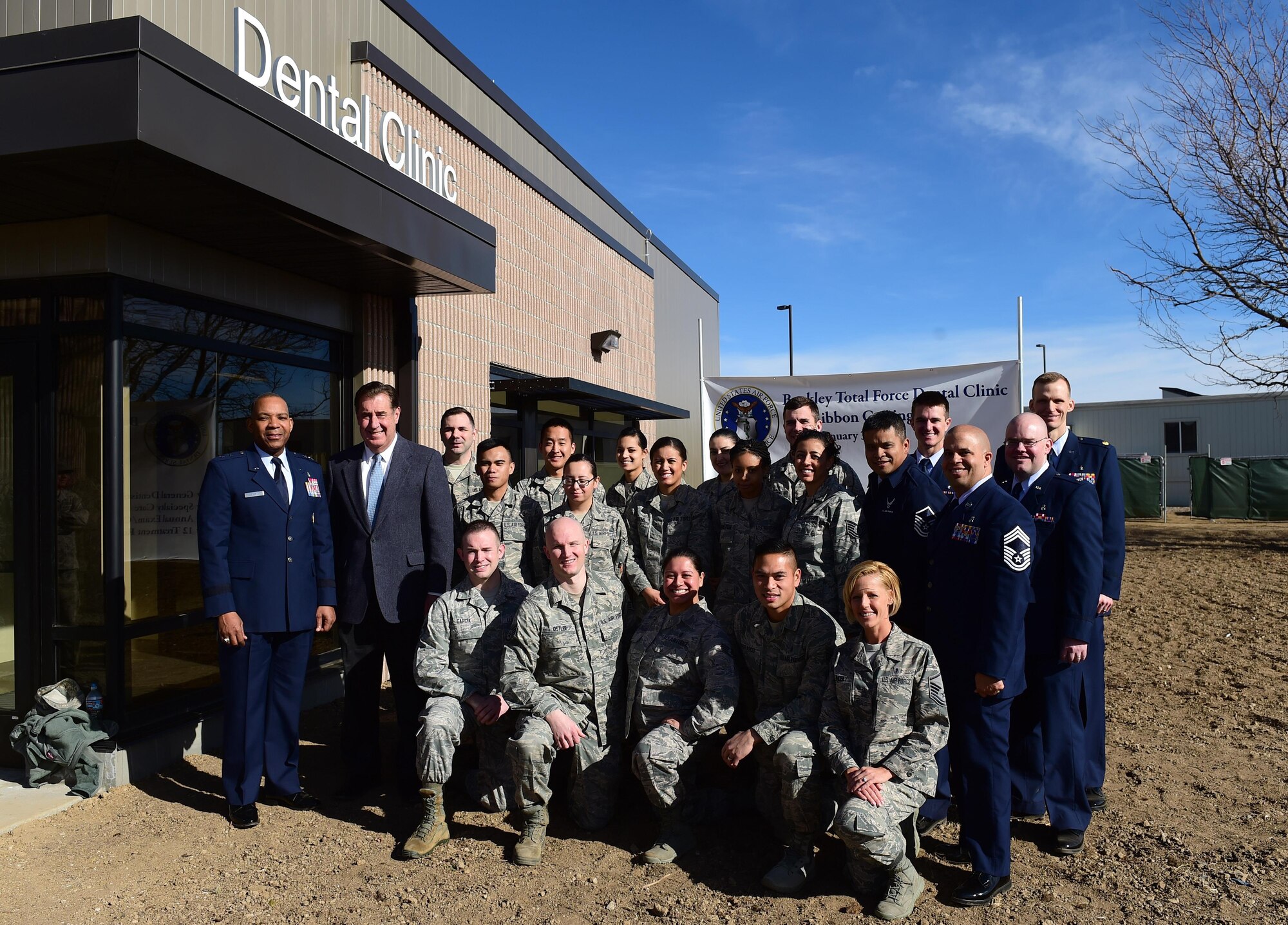 Maj. Gen. Roosevelt Allen, Medical Operations and Research Director and Chief of the Dental Corps Office of the Surgeon General in Washington D.C., and members from the 460th Space Wing stand in front of the new dental clinic Jan. 30, 2017, on Buckley Air Force Base, Colo. This is the first time since World War II that Buckley has had a dental clinic on base. (U.S. Air Force photo by Airman Jacob Deatherage/Released)