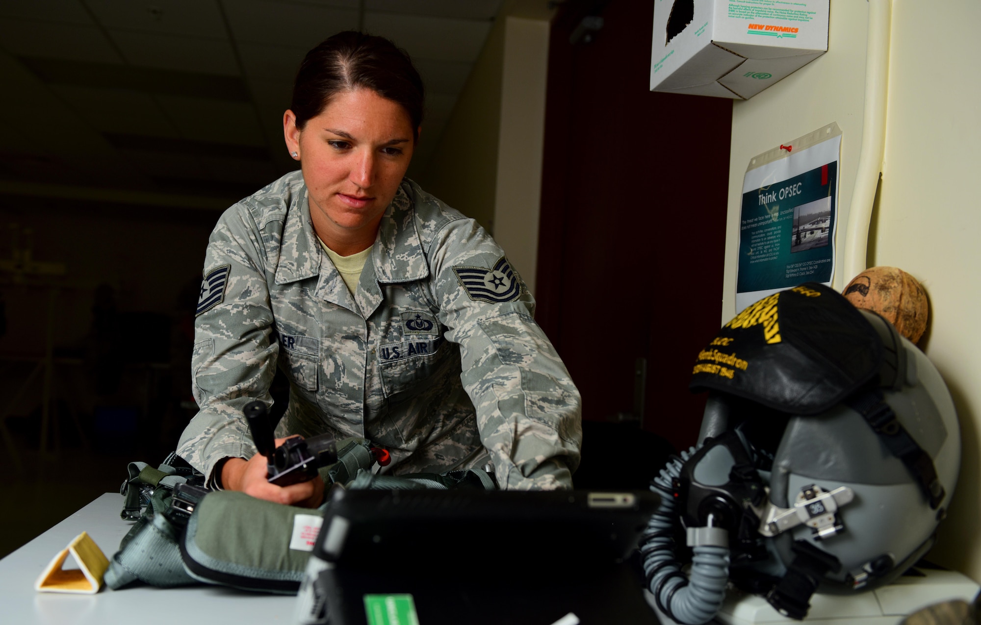 U.S. Air Force Tech. Sgt. Suzanne Koehler, an aircrew flight equipment technician assigned to the 131st Operations Support Flight, reviews a technical order while performing a 30- day inspection on a harness at Andersen Air Force Base, Guam, Jan. 24, 2017. Close to 200 Airmen and three B-2s deployed from Whiteman Air Force Base, Mo., and Barksdale Air Force Base, La., to conduct local sorties and regional training and integrate with regional allies in support of Bomber Assurance and Deterrence missions. (U.S. Air Force photo by Airman 1st Class Jazmin Smith)