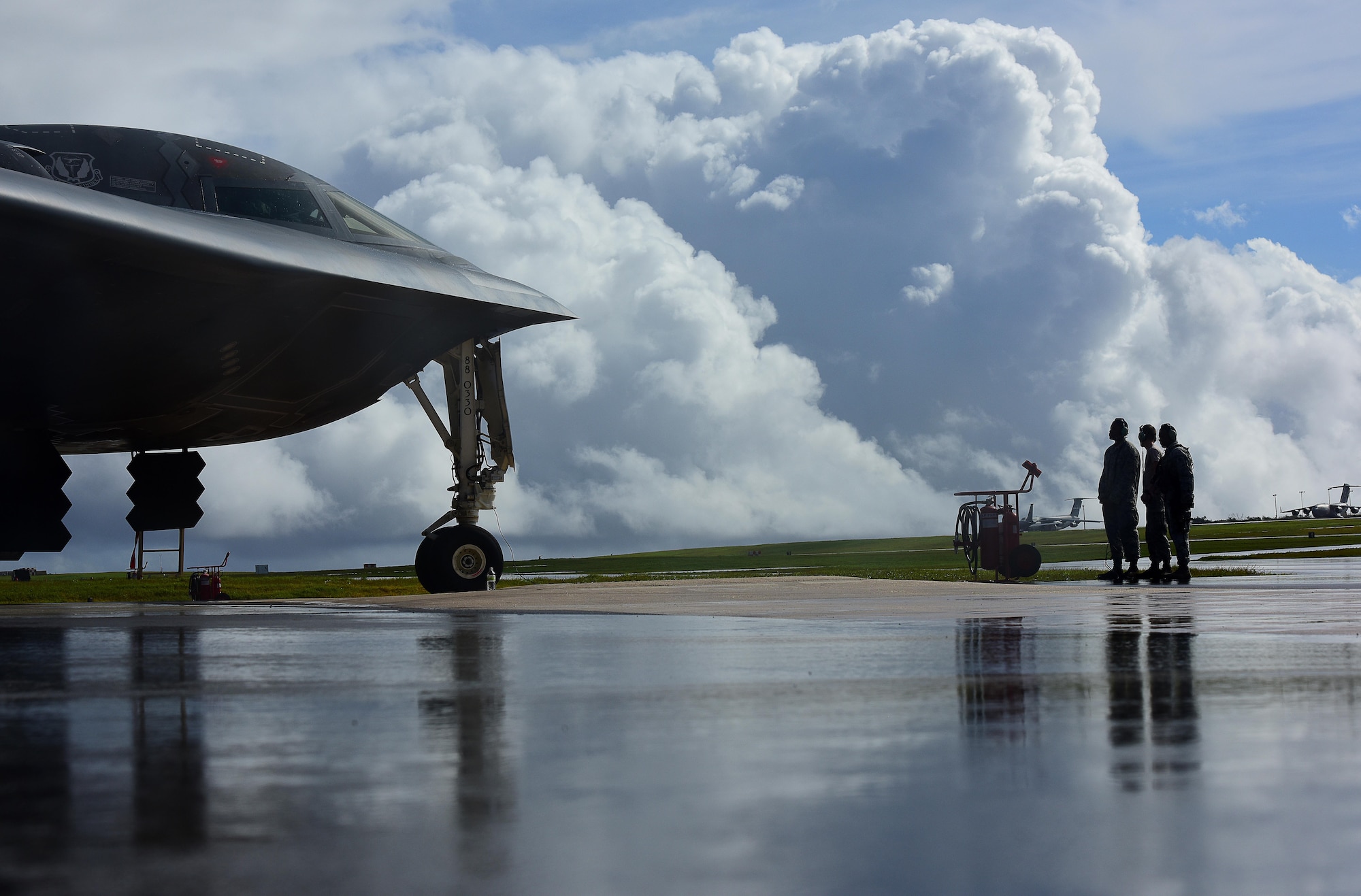 U.S. Air Force Airmen assigned to the 509th Aircraft Maintenance Squadron communicate pre-flight instructions with a B-2 Spirit pilot prior to takeoff at Andersen Air Force Base, Guam, Jan. 12, 2017. Bomber missions enable crews to maintain a high state of readiness and proficiency, and validate our always-ready global strike capability. (U.S. Air Force photo by Airman 1st Class Jazmin Smith)