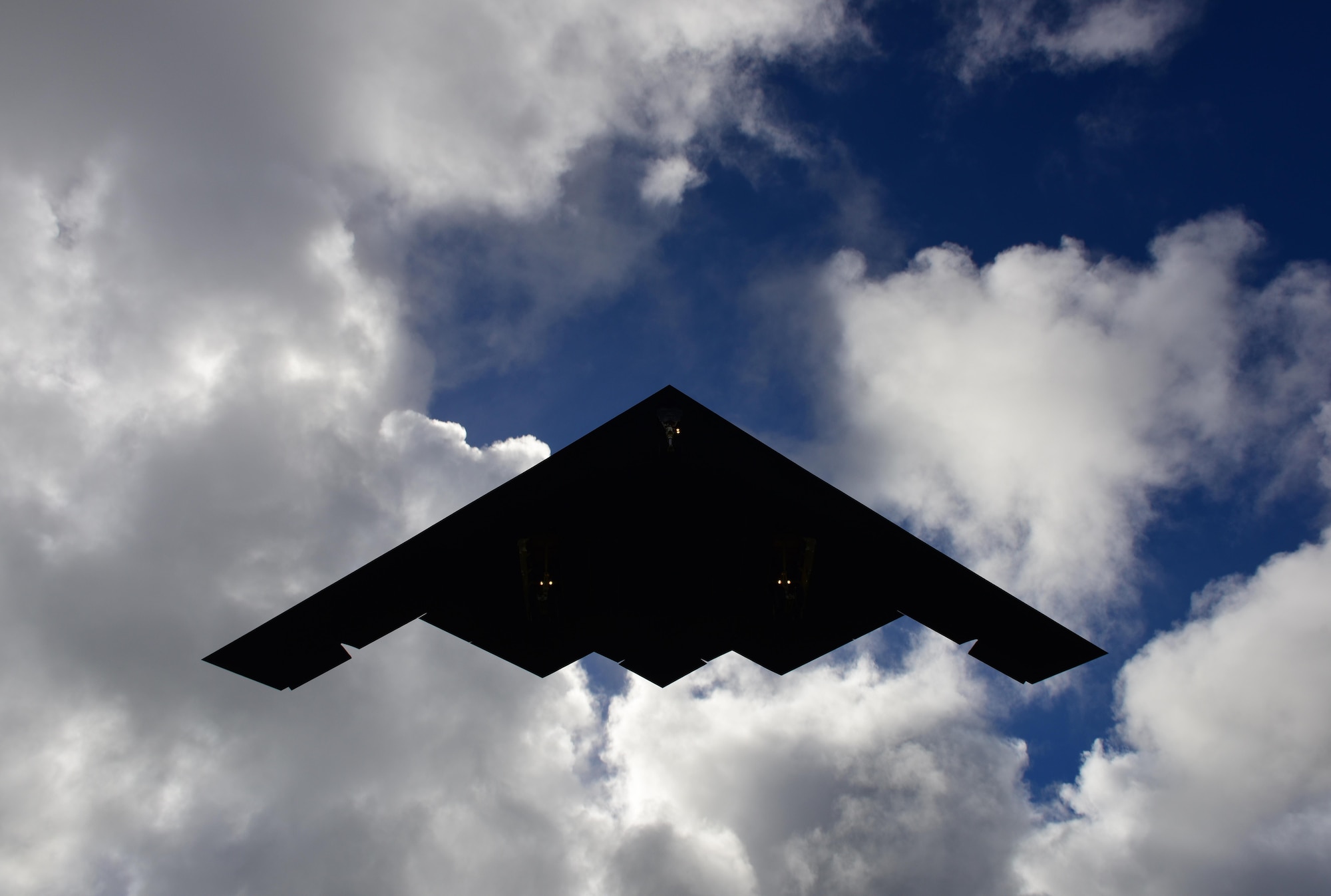 A U.S. Air Force B-2 Spirit deployed from Whiteman Air Force Base, Mo., flies overhead after returning from a local training mission at Andersen Air Force Base, Guam, Jan. 12, 2017. The B-2's low-observable, or "stealth," characteristics give it the ability to penetrate an enemy's most sophisticated defenses and threaten heavily defended targets while avoiding adversary detection, tracking and engagement. (U.S. Air Force photo by Airman 1st Class Jazmin Smith)