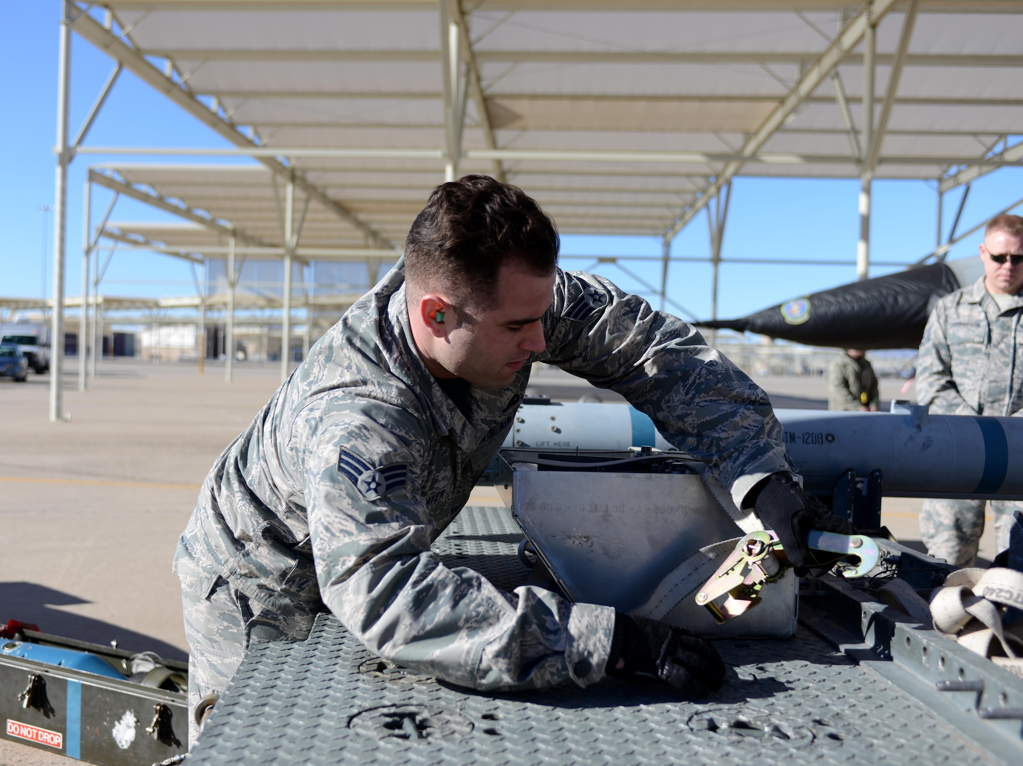 Senior Airman Derek Thayer, 310th Aircraft Maintenance Unit aircraft armament technician,  prepares a GBU-12 bomb during the Annual Load Crew Competition Jan. 27, 2017, at Luke Air Force Base, Ariz. The competition tested the Airmen’s ability to plan, prepare and execute their assigned roles in order to properly load the aircraft and accomplish the mission. (U.S. Air Force photo by Airman 1st Class Alexander Cook)