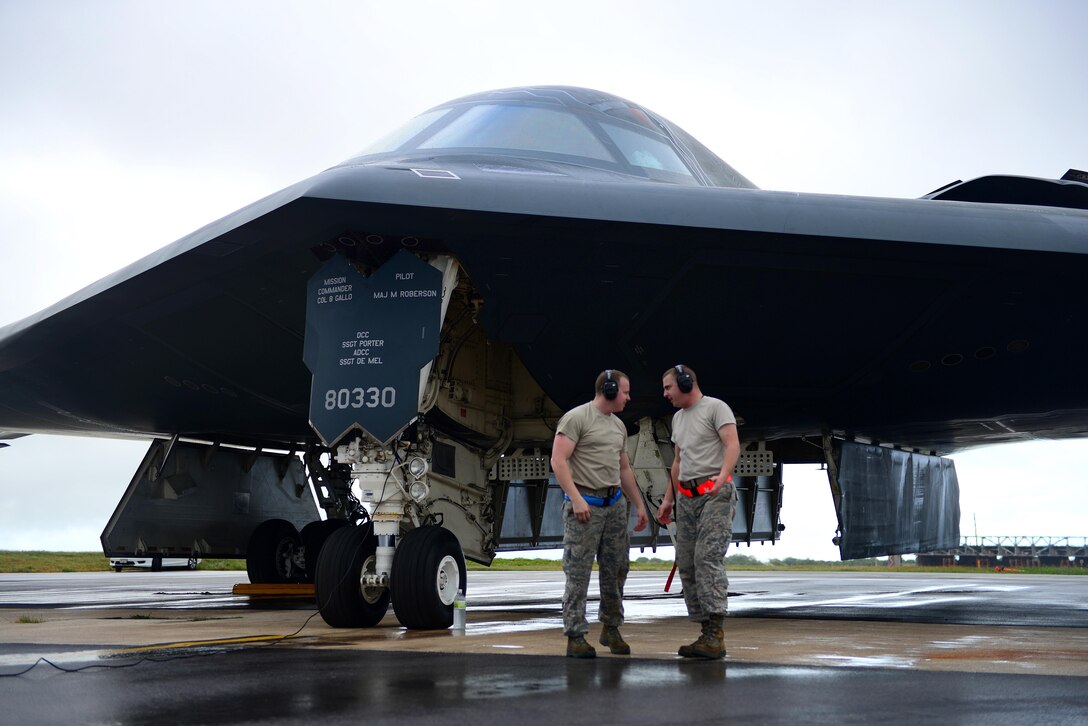U.S. Air Force Senior Airman Chase Brewer (left), speaks with Staff Sgt. Colby Nash, both electrical and environmental systems technicians assigned to the 509th Aircraft Maintenance Squadron, after conducting redball maintenance on a B-2 Spirit prior to takeoff at Andersen Air Force Base, Guam, Jan. 12, 2017. U.S. Strategic Command regularly tests and evaluates the readiness of strategic assets to ensure we are able to honor our security commitments. (U.S. Air Force photo by Airman 1st Class Jazmin Smith)