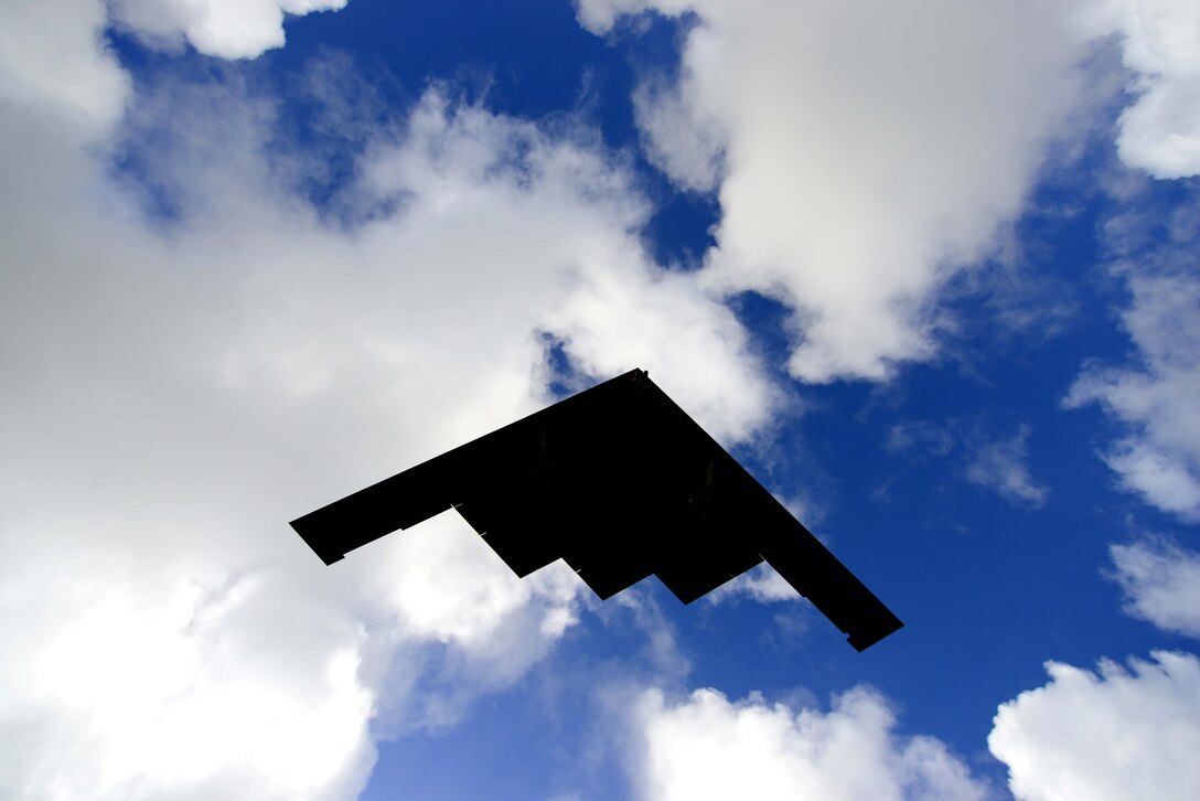 A U.S. Air Force B-2 Spirit aircraft deployed from Whiteman Air Force Base, Mo., flies overhead while returning from a local training mission at Andersen Air Force Base, Guam, Jan. 12, 2017. Close to 200 Airmen and three B-2s deployed from Whiteman Air Force Base, Mo., and Barksdale Air Force Base, La., in support of U.S. Strategic Command Bomber Assurance and Deterrence missions. USSTRATCOM, through its global strike assets, helps maintain global stability and security while enabling units to become familiar with operations in different regions. (U.S. Air Force photo by Tech. Sgt. Andy M. Kin)