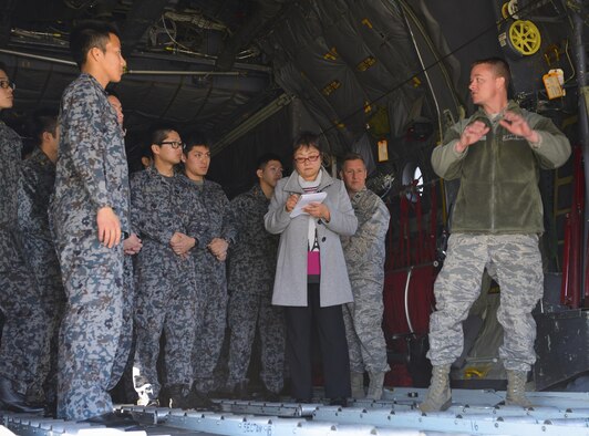 Japan Air Self Defense Force maintenance officers-in-training listen as Master Sgt. Matthew Barger, 374th Aircraft Maintenance Squadron production superintendent, explains aspects of a C-130H Hercules at Yokota Air Base, Japan, Jan. 25, 2017. The JASDF officers visited Yokota maintenance shops, spoke with personnel and observed operations in order to understand and learn from their differences. Interactive bilateral visits are designed to strengthen Japan-U.S. relations and improve how they operate together. (U.S. Air Force photo by Senior Airman Elizabeth Baker)