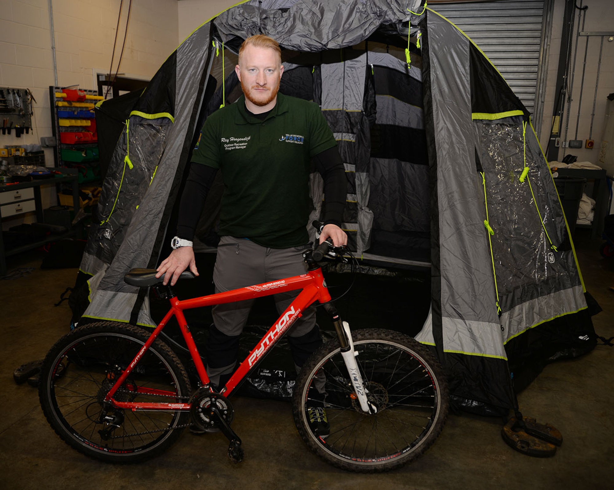 Ray Hoogendijk, 100th Force Support Squadron Outdoor Recreation program manager, shows off one of the mountain bikes and inflatable tents which can be rented from outdoor recreation Jan. 30, 2017, on RAF Mildenhall, England. The center has a wide array of items for outdoor activities available for rent, and organizes outdoor activities such as hiking, mountain biking, mountain climbing and water sports. (U.S. Air Force photo by Karen Abeyasekere)