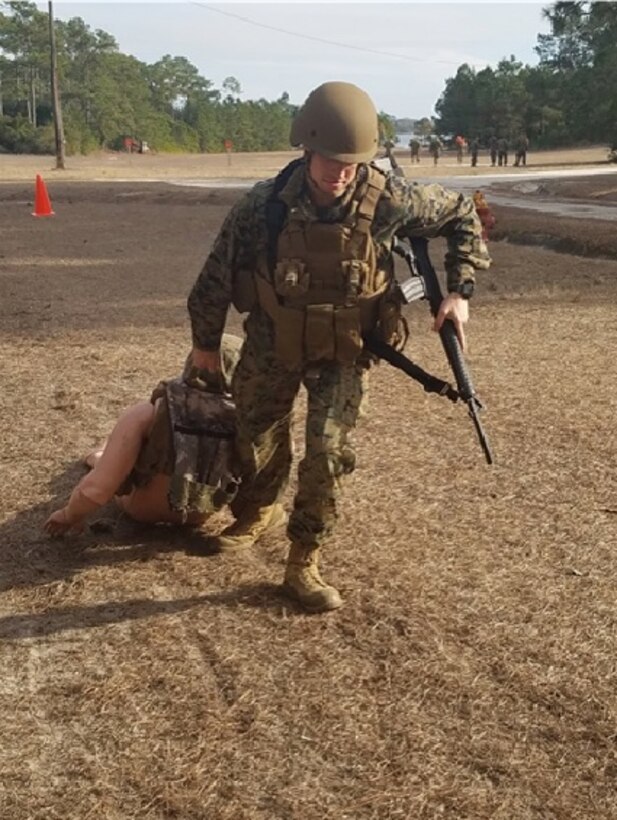 On January 17, 2017, Second Lieutenant Mitchell Bottini performs the Ground Casualty Evacuation portion of the MOS Specific Physical Standards (MSPS) evaluation.  This is one of five MSPS events and it is a 50-meter movement which simulates moving from a covered and concealed position to a casualty's position and dragging that casualty out of direct fire to a safe position.
