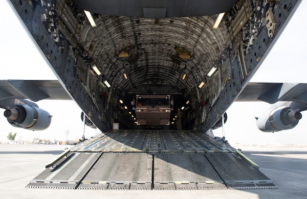 An 870th Air Expeditionary Advisory Squadron Airman drives a fire engine out of an 816th Expeditionary Airlift Squadron C-17 Globemaster III during a mission in support of Combined Joint Task Force - Operation Inherent Resolve Oct. 25, 2016. The 816th EAS delivered fire engines to Iraq. The squadrons are actively engaged in tactical airlift operations supporting the Mosul offensive. (U.S. Air Force photo by Staff Sgt. Matthew B. Fredericks)