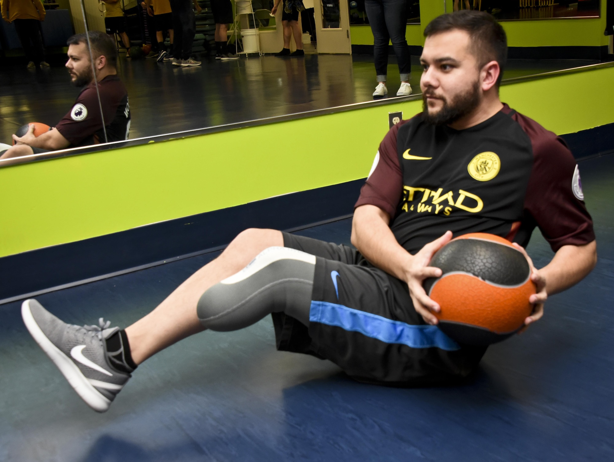 Staff Sgt. Chuck, 32nd Intelligence Squadron, 70th Intelligence, Surveillance and Reconnaissance Wing, performs the Russian Twists exercise to strengthen his core January 30, 2017 at the Gaffney Fitness Center on Fort George G. Meade. Chuck had his left leg amputated in November 2016 when he found he had the disease called Pseudomyogenic Hemangioendothelioma of Bone. (U.S. Air Force graphic/Staff Sgt. AJ Hyatt)