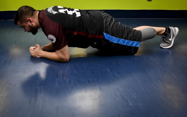 Staff Sgt. Chuck, 32nd Intelligence Squadron, 70th Intelligence, Surveillance and Reconnaissance Wing, performs a plank exercise January 30, 2017 at the Gaffney Fitness Center on Fort George G. Meade. Chuck had his left leg amputated in November 2016 when he found he had the disease called Pseudomyogenic Hemangioendothelioma of Bone. (U.S. Air Force photo/Staff Sgt. AJ Hyatt)
