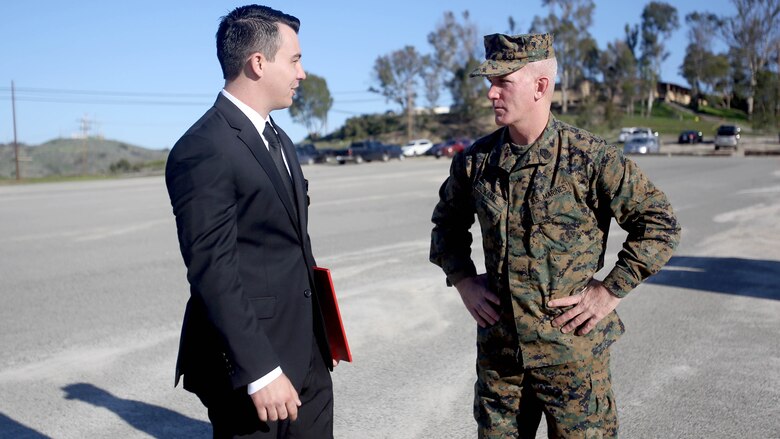 Sgt. Zachary L. Piepenhagen (left), talks to Sgt. Maj. Bradley Kasal, sergeant major, I Marine Expeditionary Force, after being awarded the Navy and Marine Corps Medal, at Marine Corps Base Camp Pendleton, California, Jan. 26, 2017. Piepenhagen was awarded the medal for saving the life of a distressed Sailor who climbed over the guard rail in an attempt to commit suicide while serving with the 13th Marine Expeditionary Unit. 