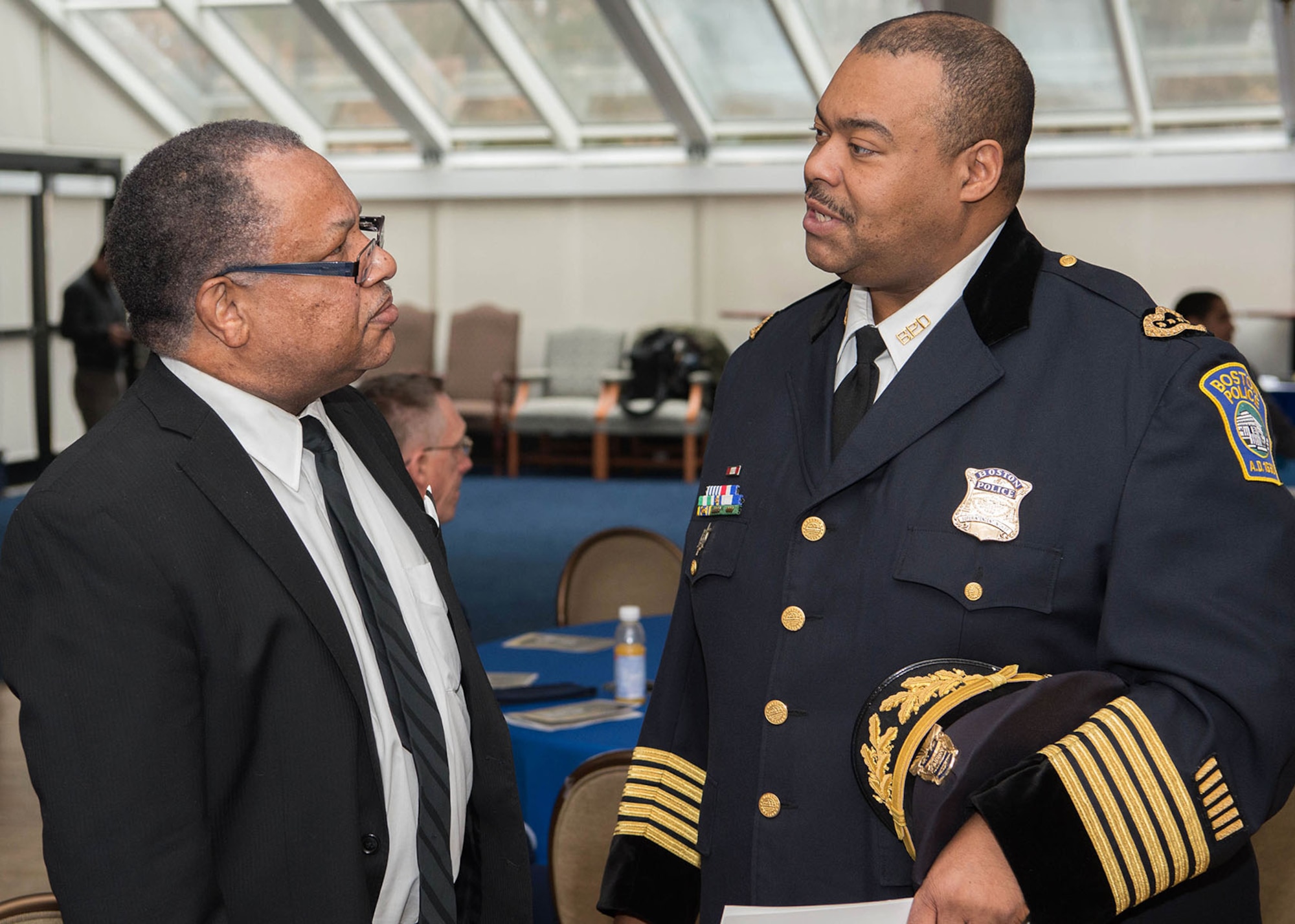 Boston Police Department Superintendent-in-Chief William G. Gross, right, speaks with Timothy Martin, 66th Security Forces Squadron employee, prior to a Dr. Martin Luther King, Jr., observance event at the Minuteman Commons Jan. 30. Gross was the event's guest speaker and Martin performed a re-enactment of MLK's "I Have a Dream" speech. (U.S. Air Force photo by Jerry Saslav)