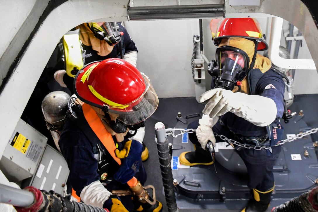 Sailors prepare to fight a simulated fire during fire drill aboard Arleigh Burke-class guided-missile destroyer USS Wayne E. Meyer in the Pacific Ocean, Jan. 25, 2017. Wayne E. Meyer is on a regularly scheduled Western Pacific deployment with the Carl Vinson Carrier Strike Group as part of the U.S. Pacific Fleet-led initiative to extend the command and control functions of U.S. 3rd Fleet into the Indo-Asia-Pacific region. Navy photo by Petty Officer 3rd Class Kelsey L. Adams