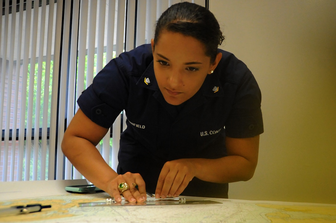 Coast Guard Petty Officer 3rd Class Casondra Minifield, a native of Winchester, Virginia, and graduate student at Marymount University, Virginia, plots a course on the waterways surrounding U.S. Coast Guard Station Curtis Bay in Baltimore, May 21, 2016. Minifield is a reservist and a boatswain’s mate at the small boat station. Coast Guard photo by Petty Officer 2nd Class Lisa Ferdinando
