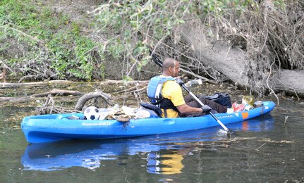Army Staff Sgt. Sy Smith, an instructor/writer with Company A, Academy Brigade (Provisional), carefully maneuvers a kayak down Salado Creek while picking trash out of the waterway during the annual Basura Bash at Salado Creek Park at Joint Base San Antonio-Fort Sam Houston during last year’s Basura Bash Feb. 20, 2016. The kayaks were provided by JBSA Morale, Welfare and Recreation.