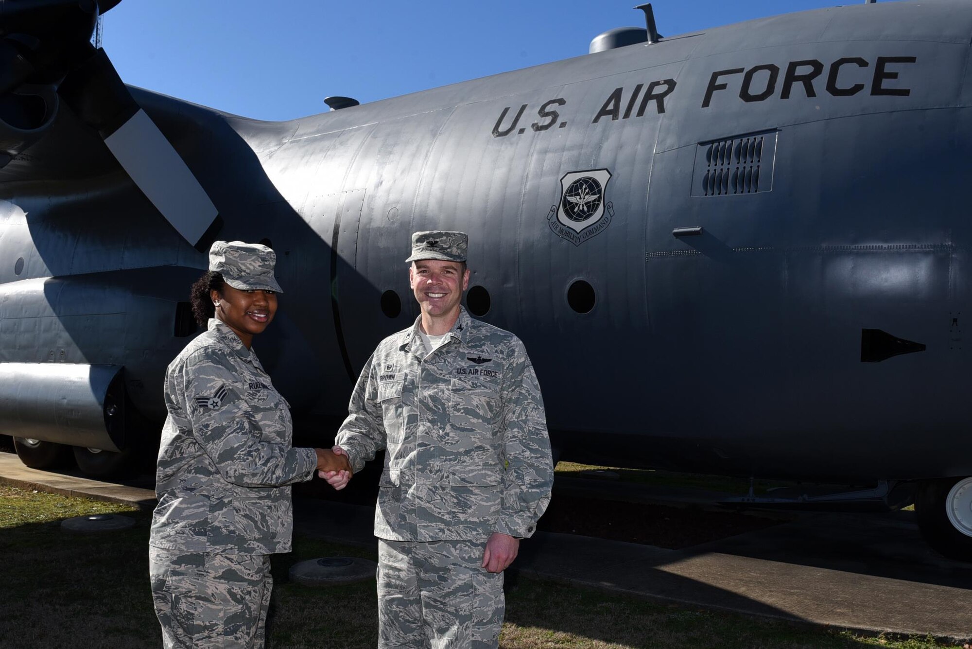 U.S. Air Force Col. Charles Brown, 19th Airlift Wing commander, congratulates U.S. Air Force Senior Airman Brianna Ruiz-Garcia, 19th Communications Squadron command support staff, as the Combat Airlifter of the Week Jan. 30, 2017, at Little Rock Air Force Base, Ark. (U.S. Air Force photo by Airman Kevin Sommer)