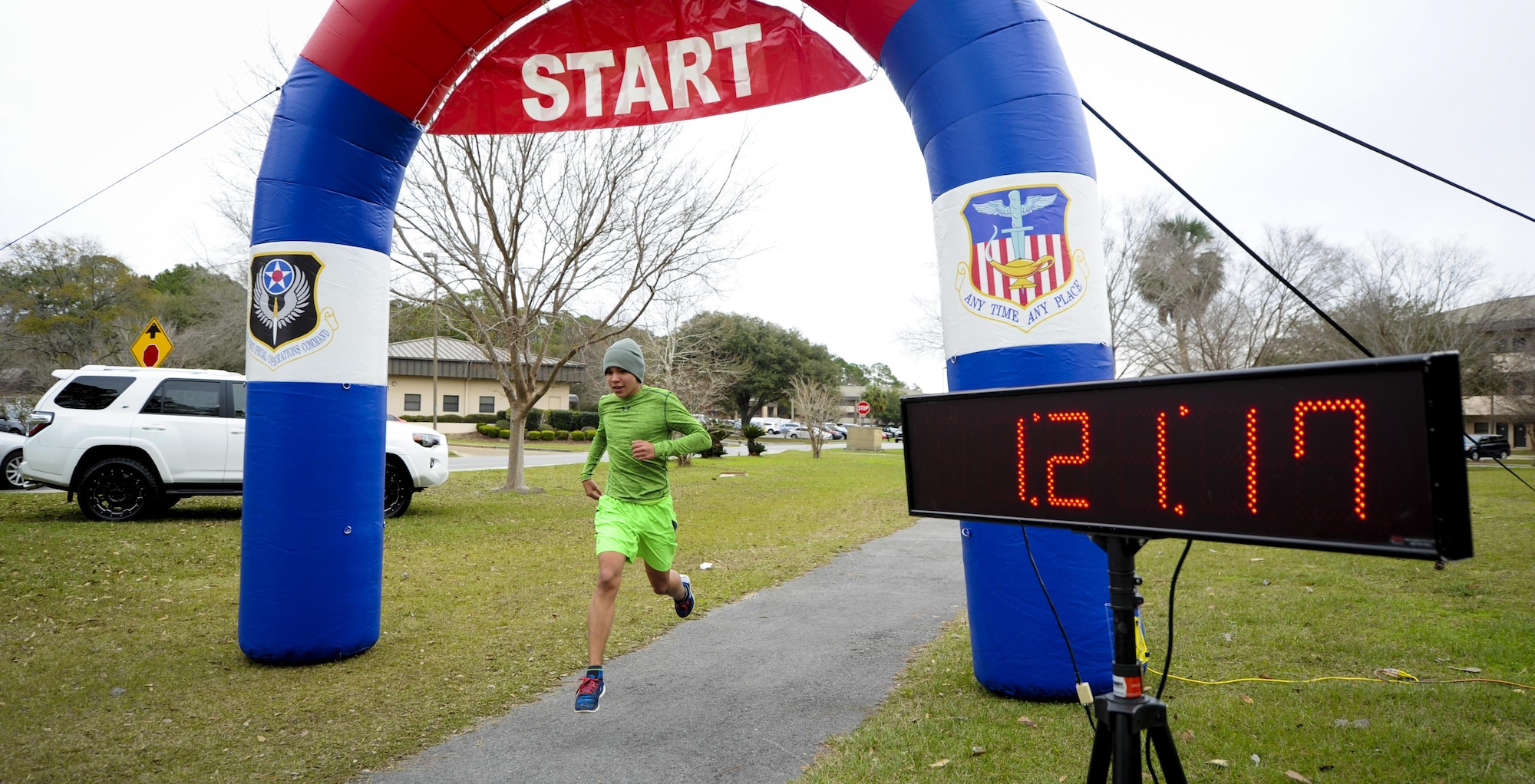 A runner is the first out of 139 runners to cross the finish line during a 5k at Hurlburt Field, Fla., Jan. 28, 2017. The 1st Special Operations Force Support Squadron held a 5k event and a half-marathon for Air Commandos and their families. The 5k event began one hour after the half-marathon. (U.S. Air Force photo by Airman Dennis Spain)