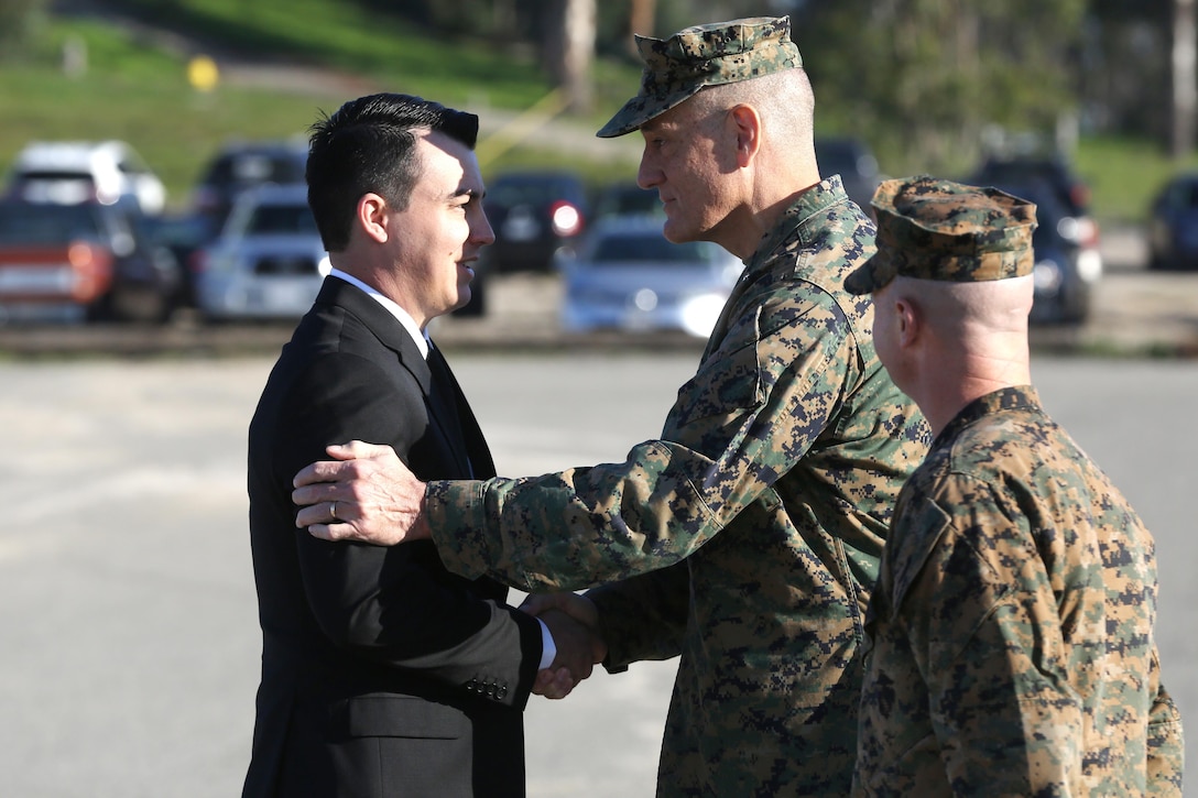 Sgt. Zachary L. Piepenhagen (left), shakes hands with Maj. Gen. David Coffman, deputy commanding general, I Marine Expeditionary Force, after being awarded the Navy and Marine Corps Medal, at Marine Corps Base Camp Pendleton, Calif., Jan. 26, 2017. Piepenhagen was awarded the medal for saving the life of a distressed Sailor who climbed over the guard rail in an attempt to commit suicide while serving with the 13th Marine Expeditionary Unit. (U.S. Marine Corps photo by Private First Class Gabino Perez)