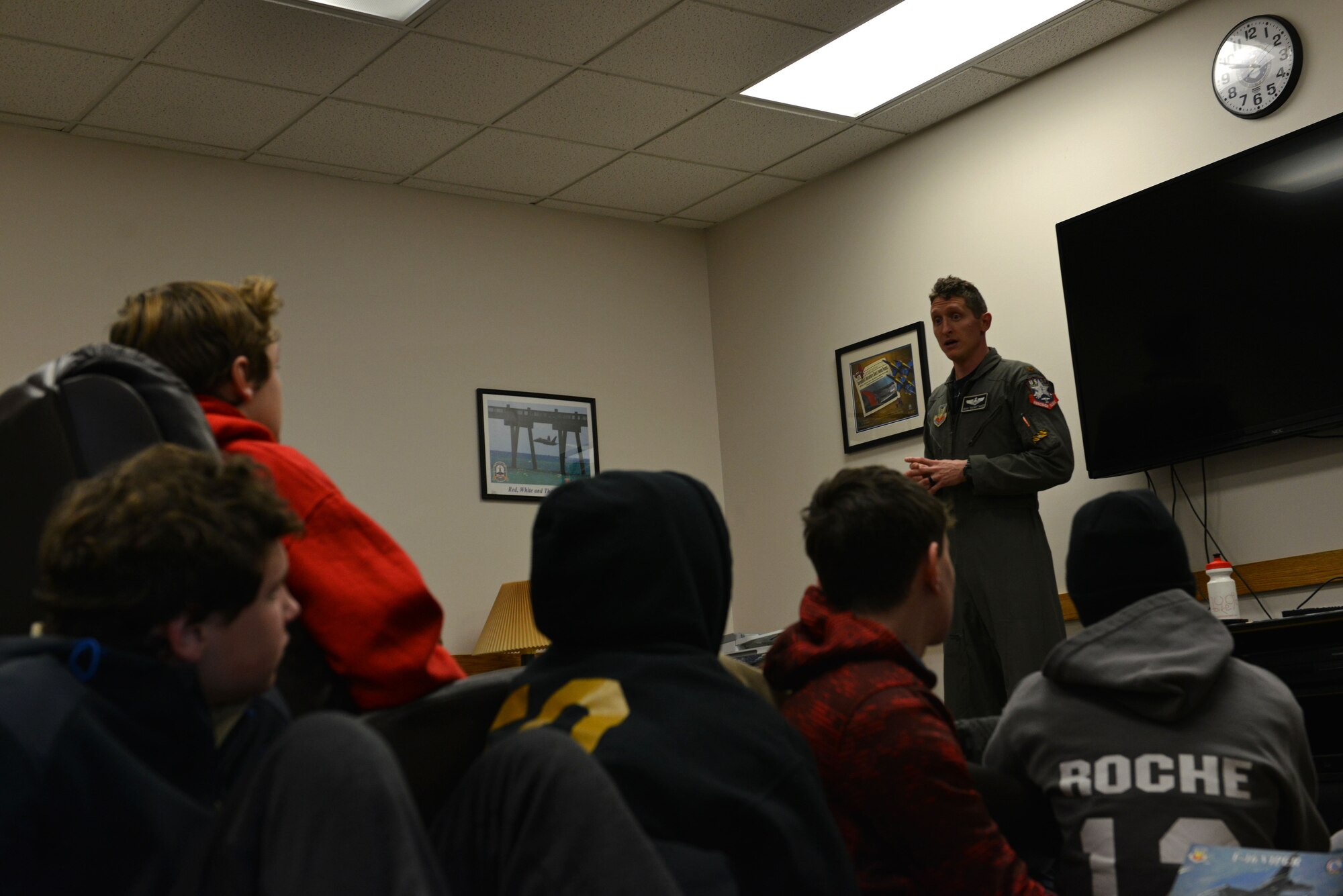 U.S. Air Force Maj. Craig Baker, Air Combat Command’s F-16 Viper Demo Team pilot, answers questions from a Boy Scout Troop at Shaw Air Force Base, S.C., Jan. 27, 2017. The guests asked Baker questions about the capabilities of the F-16CM Fighting Falcon after watching his performance. (U.S. Air Force photo by Airman 1st Class Destinee Sweeney)