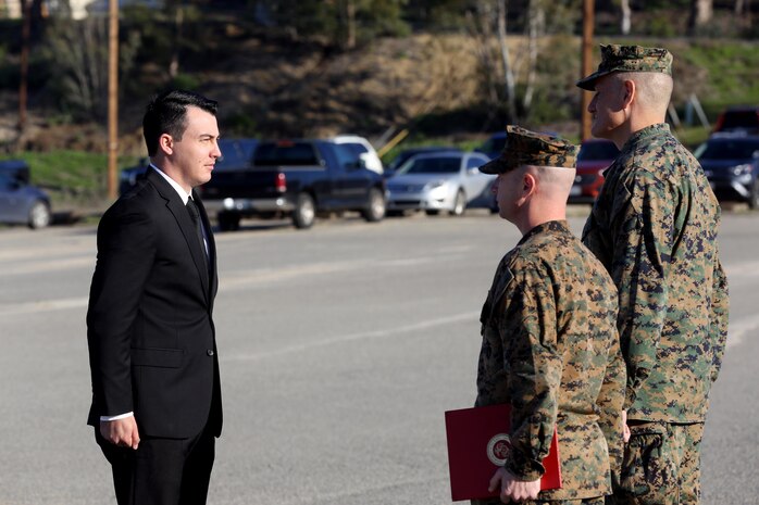 Sgt. Zachary L. Piepenhagen (left), stands at attention as Maj. Gen. David Coffman (right), deputy commanding general, I Marine Expeditionary Force, awards him the Navy and Marine Corps Medal, at Marine Corps Base Camp Pendleton, Calif., Jan. 26, 2017. Piepenhagen was awarded the medal for saving the life of a distressed Sailor who climbed over the guard rail in an attempt to commit suicide while serving with the 13th Marine Expeditionary Unit. (U.S. Marine Corps photo by Private First Class Gabino Perez)
