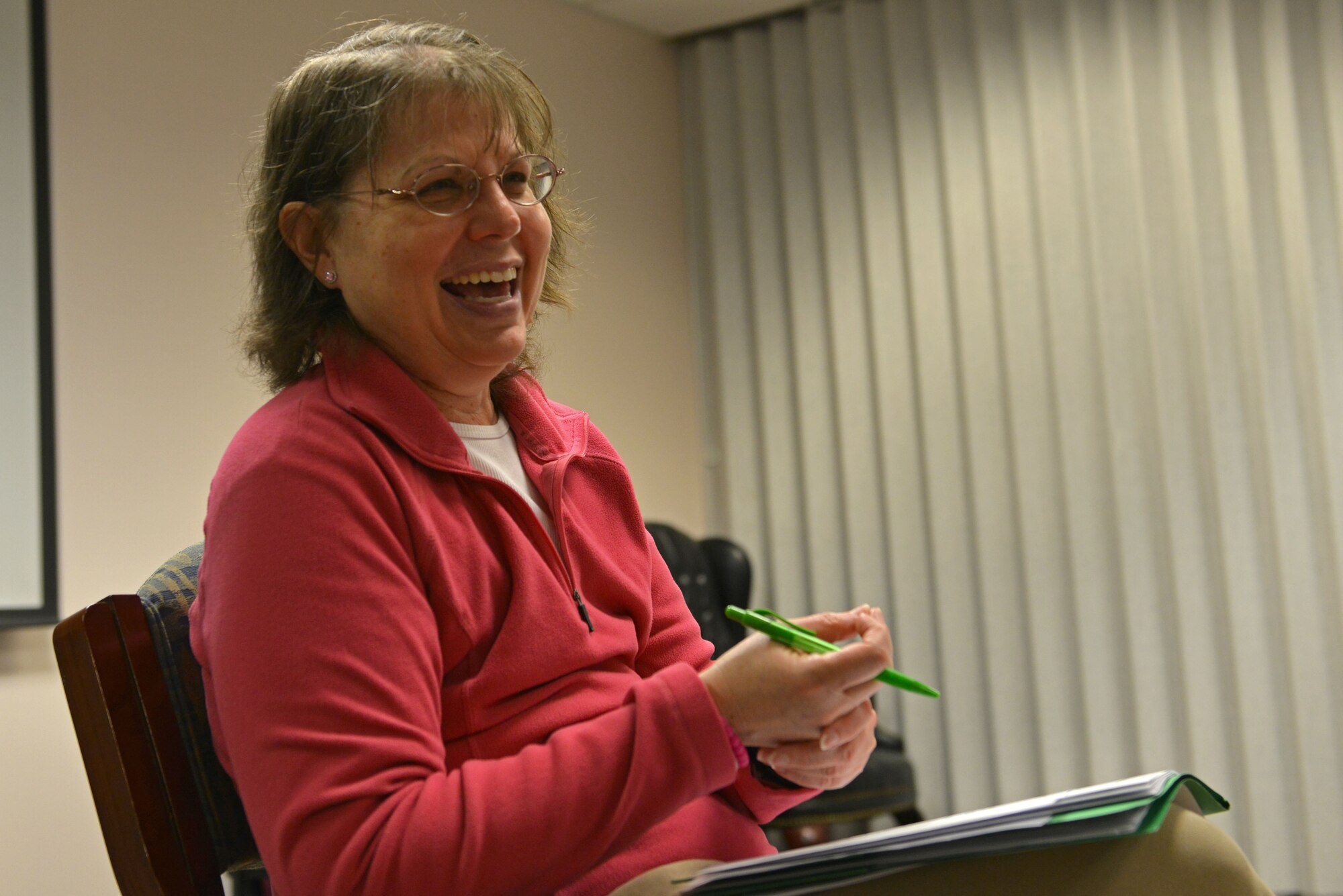 Teri Galter, 20th Medical Operations Squadron Healthcare to Health registered dietitian and Group Lifestyle Balance (GLB) instructor, laughs while hosting a GLB session with her students at Shaw Air Force Base, S.C., Jan. 26, 2017. During a GLB class, students are given resources and share ideas on how to improve and maintain a healthy lifestyle in an open discussion forum. (U.S. Air Force photo by Airman 1st Class Destinee Sweeney)