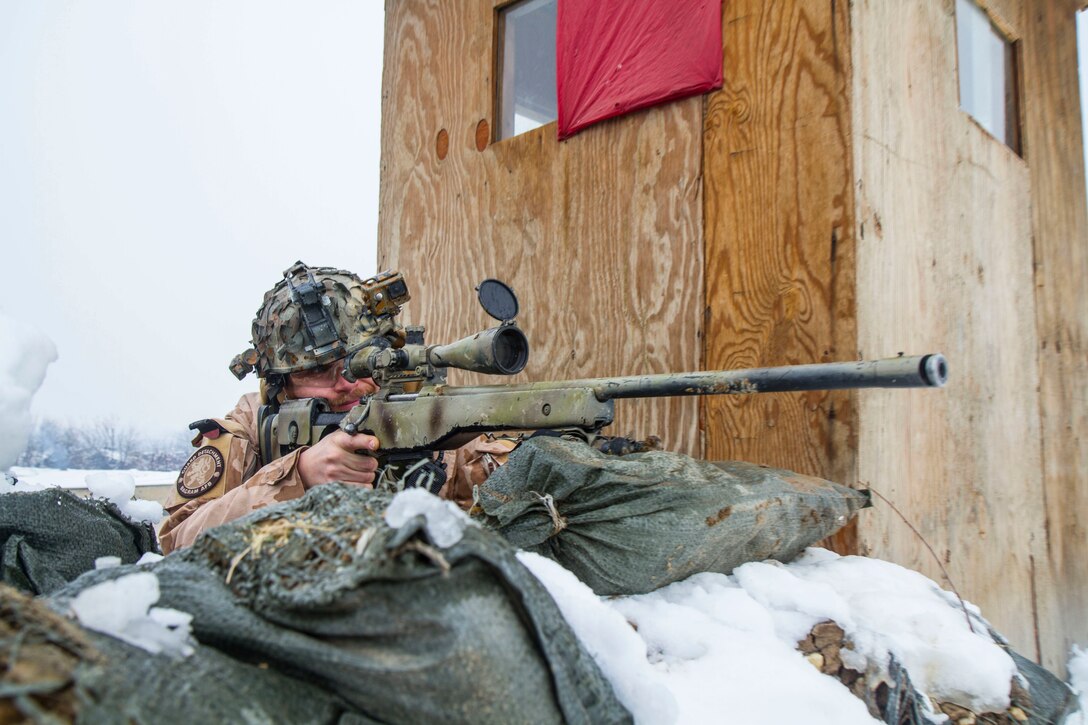A Czech Republic sniper during a supply delivery to the people of Parwan Province, Afghanistan.