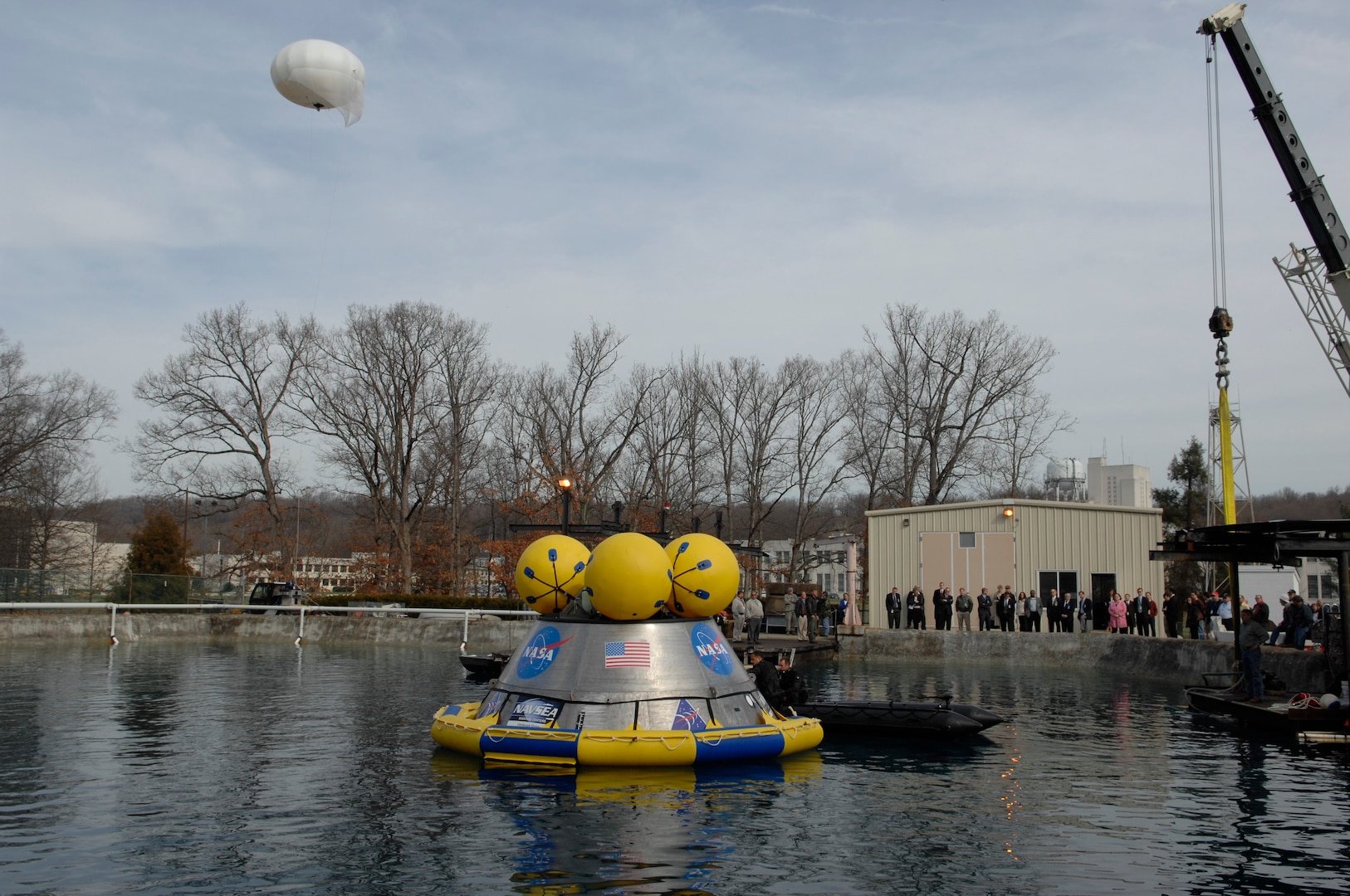 Naval Surface Warfare Center, Carderock Division engineers, along with a NASA test and evaluation team conducted initial post-landing Orion Recovery Test operations, March 23-27, 2009, of a full-scale model of NASA’s Orion space capsule at Carderock’s pentagon-shaped test pond in West Bethesda, Md. The Orion model will be on display in Houston during the week leading up to Super Bowl LI. (U.S. Navy photo by Ryan Hanyok/Released)