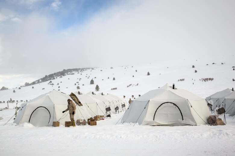Marines with 2nd Battalion, 2nd Marine Regiment, inhabit Artic Tents at a tent city located in Grouse Meadows training area during Mountain Training Exercise 1-17 in the vicinity of the Marine Corps Mountain Warfare Training Center Bridgeport, Calif., Jan, 18, 2016. MCMWTC is one of the Marine Corps’ most secluded posts, comprised of approximately 46,000 acres of terrain with elevations ranging from 5,000 to 11,000 feet. During this iteration of MTX, the inclusion of the Artic Tent, designed to house up to 15 personnel, enabled the “Warlords” to be truly immersed in the frigid landscape throughout the full duration of the training. (U.S. Marine Corps photo by Cpl. Levi Schultz)