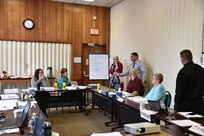Mr. Carlos Alvarado, Safety and Occupational Health Specialist for the 1st Mission Support Command and Professional Continuity Practitioner Level 1 (FEMA), reviews the ten elements of continuity of operations plan during a planning assistance visit to Catholic Charities of Oneida/Madison County, January 23 through the 27th.