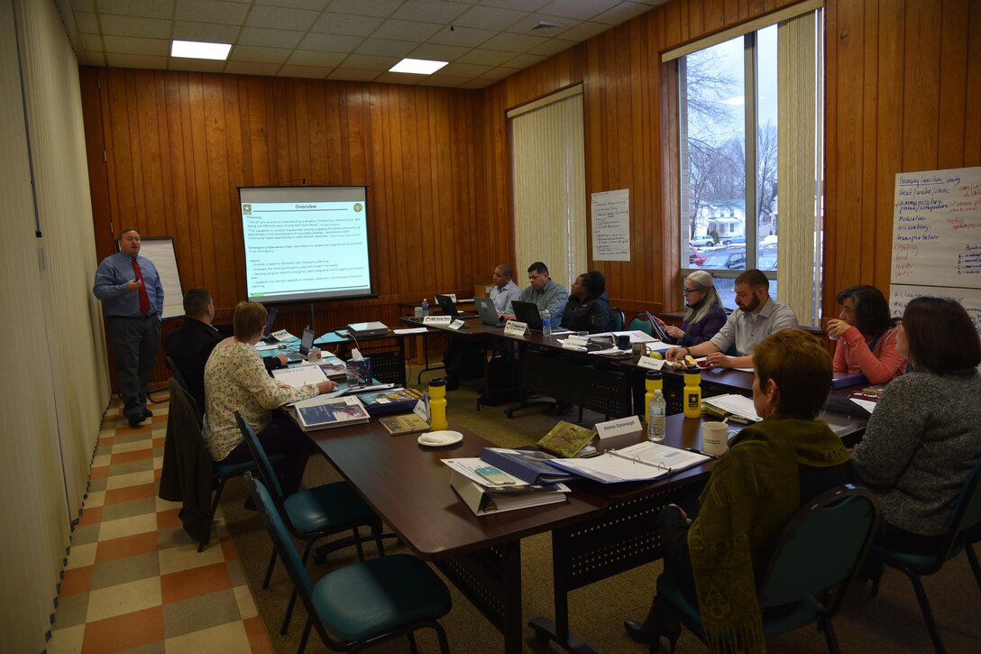 Mr. Robert Stabb, Emergency Management Specialist at U.S. Army Reserve Command, begins his training session on Emergency Management Planning during a planning assistance visit to Catholic Charities of Oneida/Madison County, January 23 through the 27th.