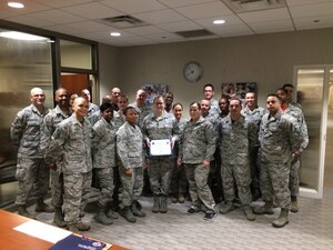 U.S. Air Force Staff Sgt. Brianna Williams, Armed Forces Medical Intelligence Center Det 8 NCO in charge, poses with members of the First Sergeants Council after receiving the Diamond Sharp award at Joint Base Langley-Eustis, Va., Jan. 23, 2017. Williams was selected for the award after she took on a variety of programs including unit leave manager, records custodian, facility management, unit fitness program manager and unit reserve coordinator. (courtesy photo)  