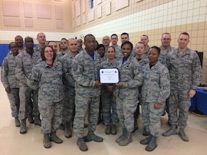 U.S. Air Force Senior Airman Tiffany Cross, 440th Supply Chain Operations Squadron allowance and authorization journeyman, poses with members of the First Sergeants Council after receiving the Diamond Sharp award at Joint Base Langley-Eustis, Va., Jan. 23, 2017. Cross was chosen for the award after she stepped up into a key leadership role within the Fighter-Bomber Equipment Flight and was hand-picked to be a member of the Defense Property Accountability System transition team for the 440th SCOS, where she received vital training for future equipment accountability operations while assisting the 441st Vehicle Supply Chain Operations Squadron process 38 equipment transfers, ensuring 100 percent asset accountability. (courtesy photo)