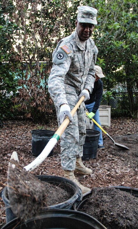 Army Warrant Officer 3 Fred L. Hemphill, a Montgomery, Ala., native serving as a property book officer, Headquarters and Headquarters Company, 143d Sustainment Command (Expeditionary), digs out old soil to make space for fresh soil during a an environmental sustainability community project Jan. 27, 2017, in Orlando, Fla. Torres and six other Army Reserve Soldiers joined scores of volunteers from the Orlando community to help bring Colonialtown North Community Garden back to its former, greener glory. Directed by Green Works Orlando in conjunction with the National Football League’s Environmental Program, the garden’s revival was one of the many community projects both organizations managed to lighten the environmental footprint produced by the tens of thousands of football fans who have flocked to The City Beautiful to watch the NFL’s first Pro Bowl game to take place in Florida since 1977. 