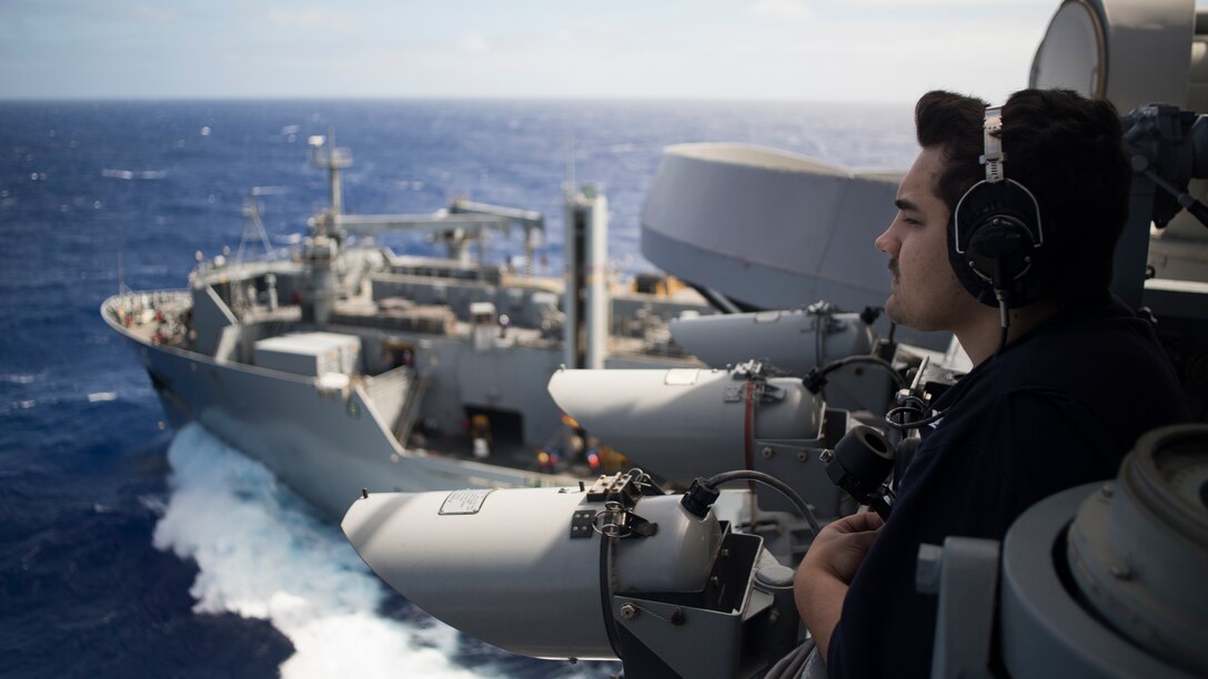Navy Petty Officer 3rd Class Tristen Stallsworth stands forward lookout on the aircraft carrier USS Carl Vinson during a replenishment with the Military Sealift Command dry cargo and ammunition ship USNS Charles Drew in the Pacific Ocean, Jan. 28, 2017. Stallsworth is an operations specialist. Navy photo by Petty Officer 3rd Class Theo Shively