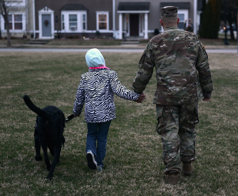 U.S. Army Sgt. Matthew Johns, 221st Military Police Detachment military police officer, and his daughter AudreeAna, age six, walk her service dog, Hope, at Joint Base Langley-Eustis, Va., Jan. 5, 2017. Before arriving to JBLE due to a permanent change of station, the Johns family worked with the Exceptional Family Member Program, a mandatory program for all active-duty service members with special needs family members. (U.S. Air Force photo by Staff Sgt. Teresa J. Cleveland)