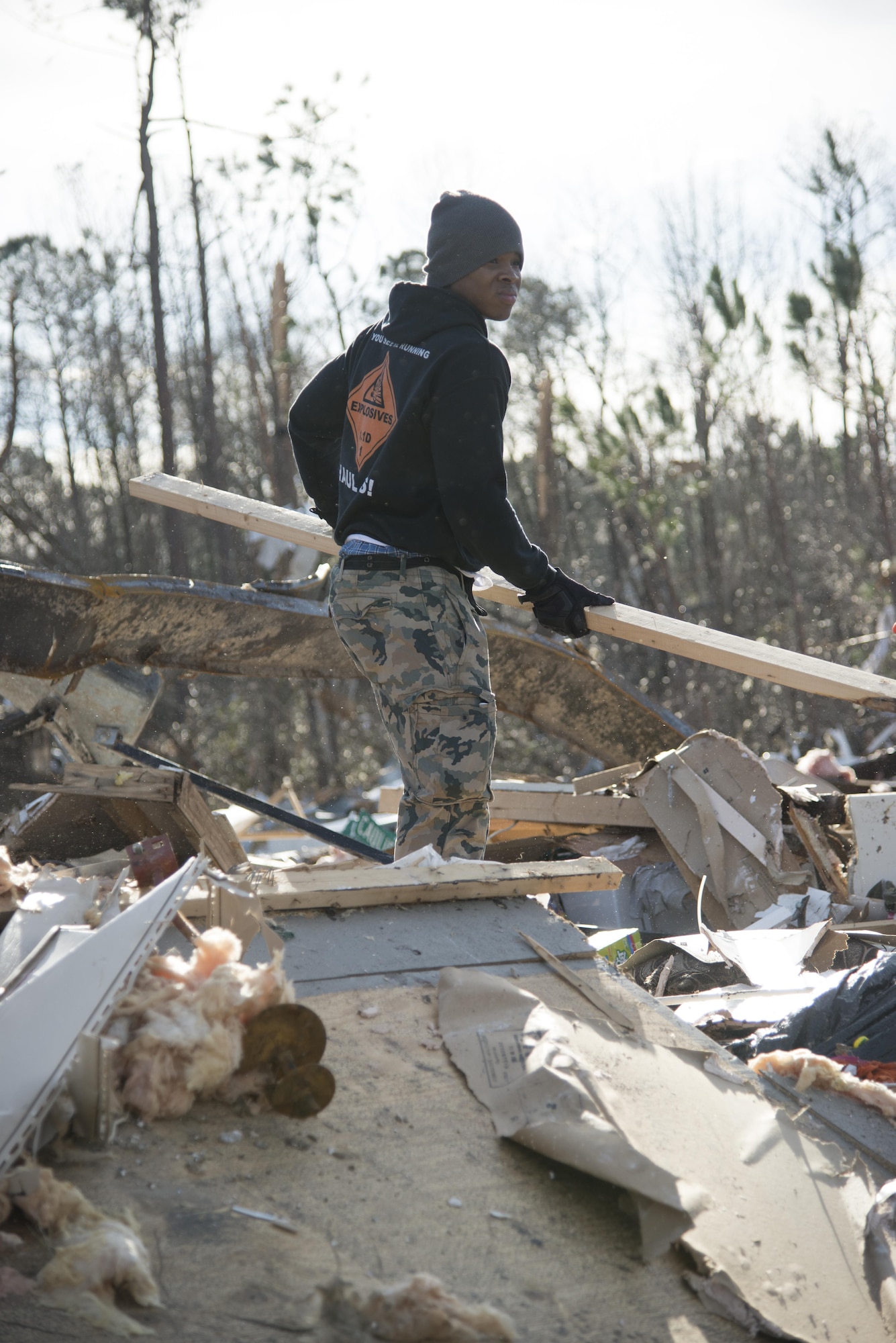 A Moody Air Force Base Airman salvages wood from piles of debris, Jan. 28, 2017, in Adel, Ga. The tornado killed 15 people and was later deemed an EF3, the strongest tornado to touch down in the county’s history. (U.S. Air Force photo by 2d Lt. Kaitlin Toner)